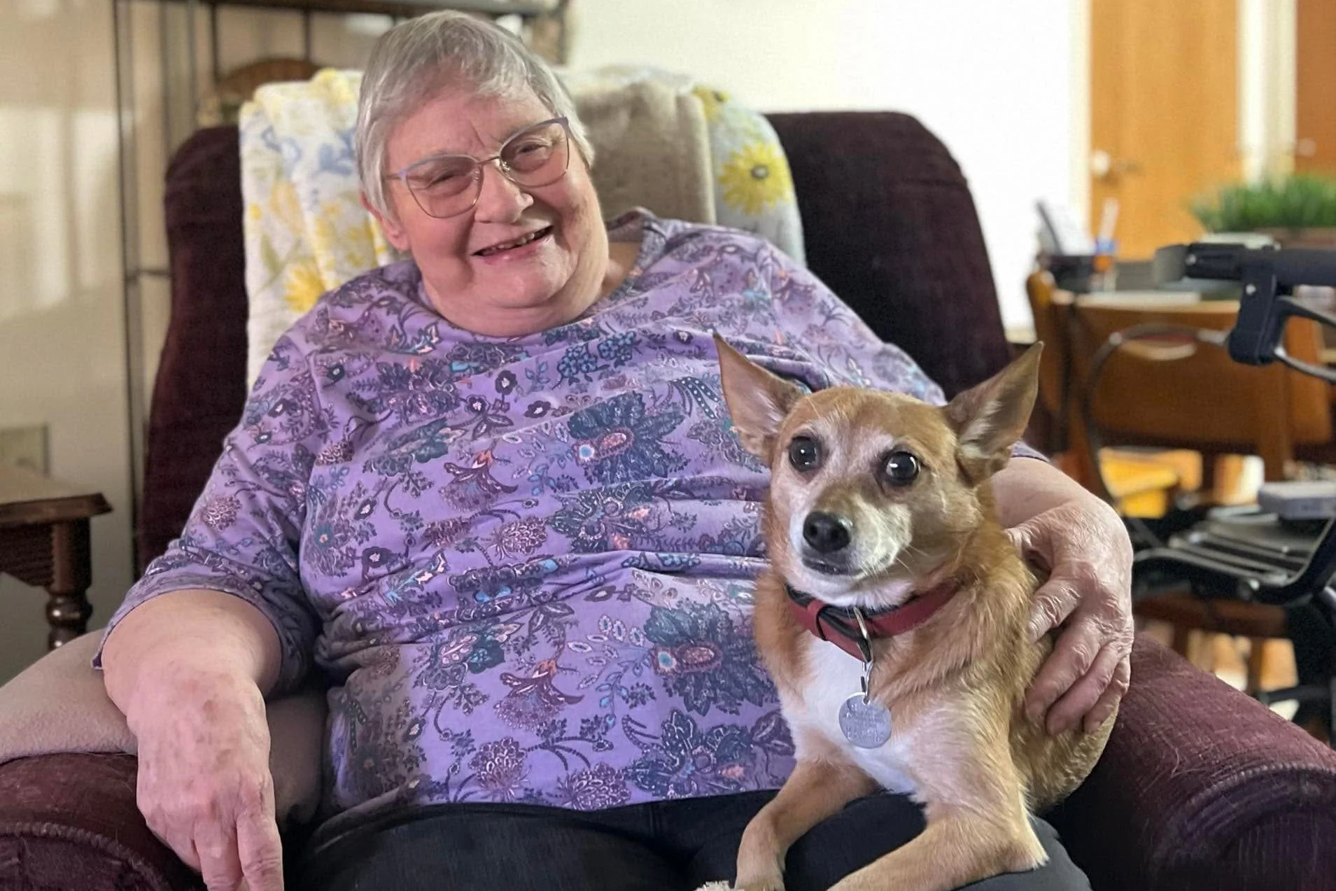Resident with their pet in a pet-friendly apartment at Horton Plaza senior retirement community in Medford, OR Resident with their pet in a pet-friendly apartment at Horton Plaza senior retirement community in Medford, OR